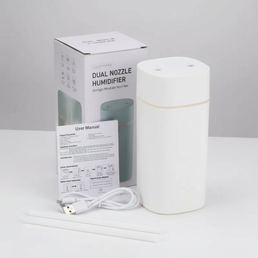 White dual nozzle humidifier with packaging and USB cable on a white background
